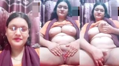 Sexy bespectacled aunty fingered her pink pussy while pressing her big boobs