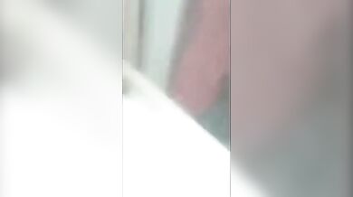 Couple having sex behind building seen through window